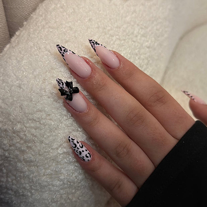 Artful Stiletto Nails with Leopard Print and Bow Accent Stornfield