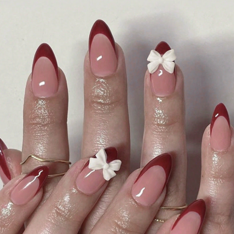 Acrylic nail set with elegant lace design and romantic bows Stornfield