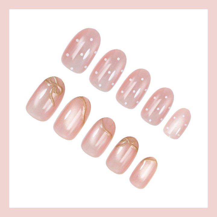 Artificial nail set with shimmering accents and elegant gold embellishments Stornfield