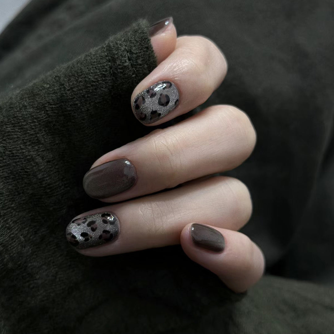 Artistic Press-On Nail Design with Glossy and Textured Patterns Stornfield