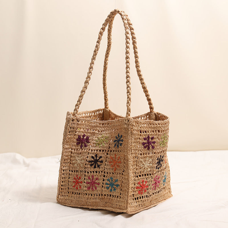 Handcrafted straw bag with colorful embroidery design Stornfield