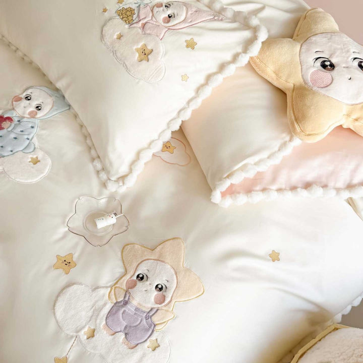 Bedding set for children with stitched cloud and star appliqués