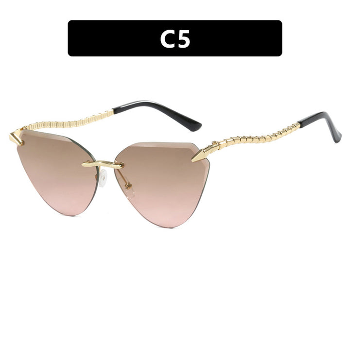 Women's Cat-Eye Sunglasses with unique gold frame design and protective lenses Stornfield