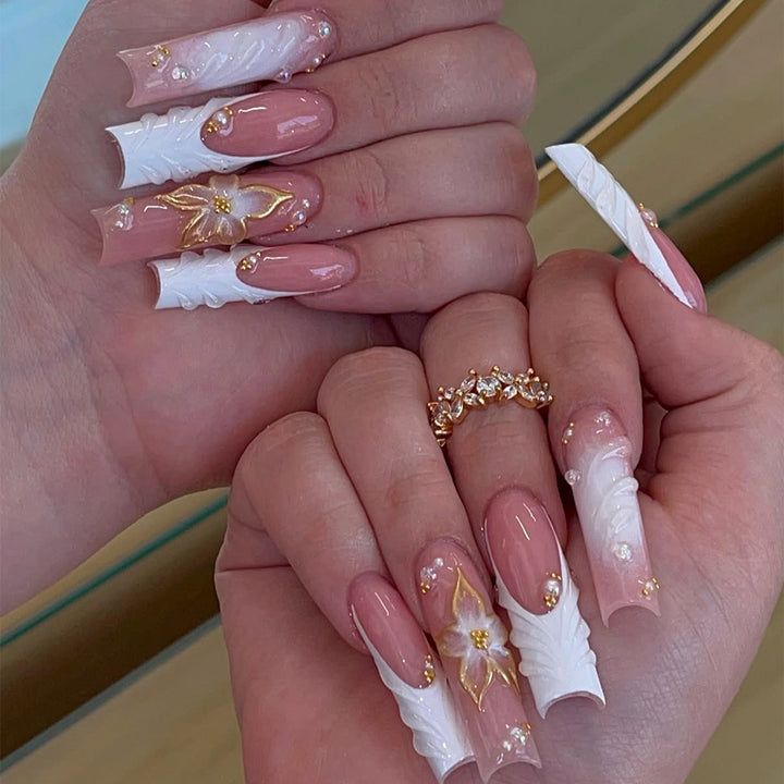 Artificial nails with handcrafted floral accents Stornfield