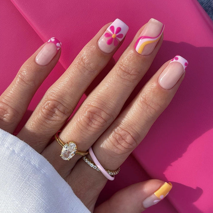 Creative Nail Art with Floral Design and Colorful Accents Stornfield