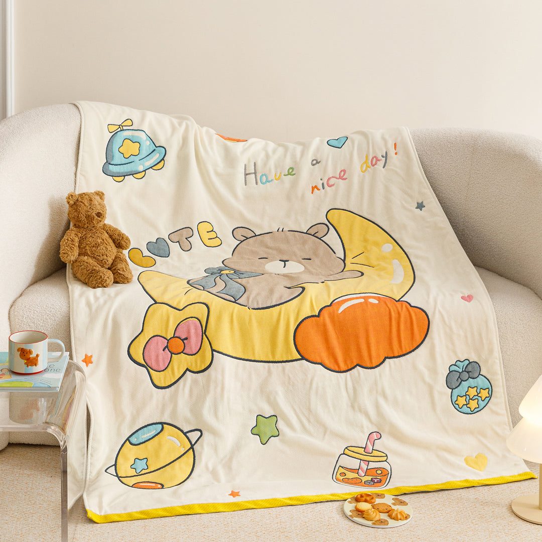 Kids' cuddly blanket with cheerful vehicle print made of soft microfibre