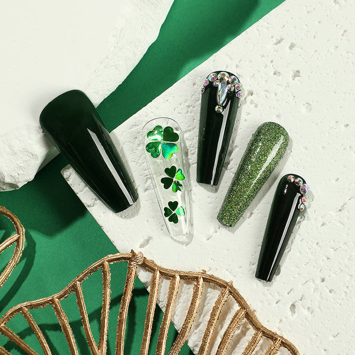 Artificial nail art with clover leaf motifs Stornfield