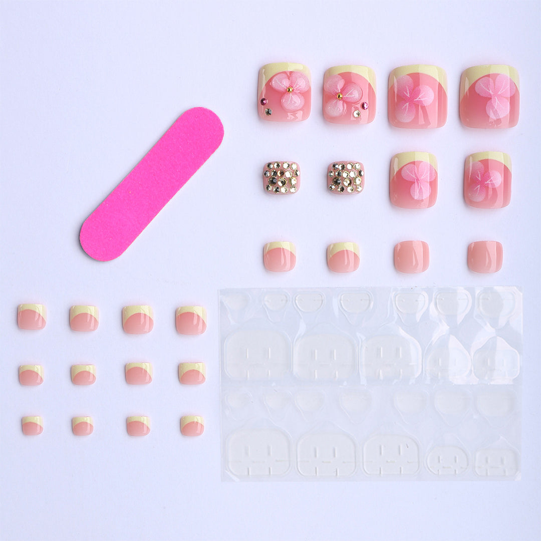 Artificial nail extensions with flower design and glitter accents Stornfield