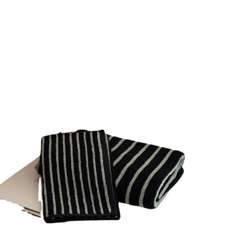 Large cotton terry towel with striped pattern and high absorbency