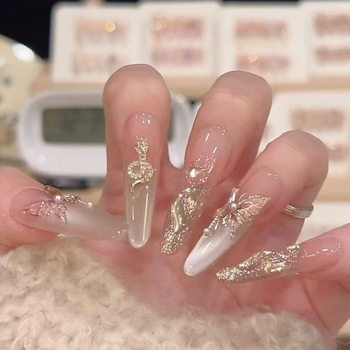 Artistic Nail Extensions with Decorative Elements Stornfield