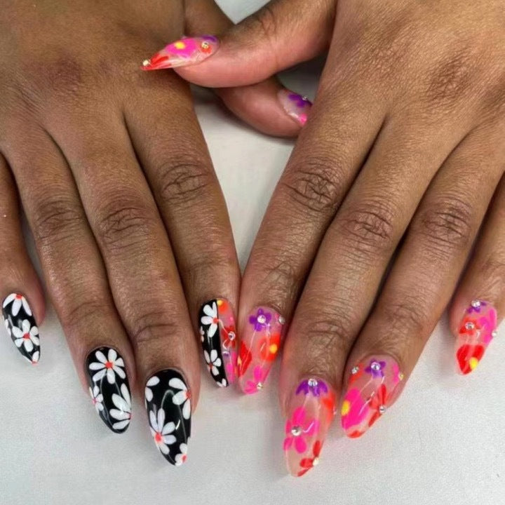 Artificial nail set with floral 3D embellishments and glitter accents Stornfield