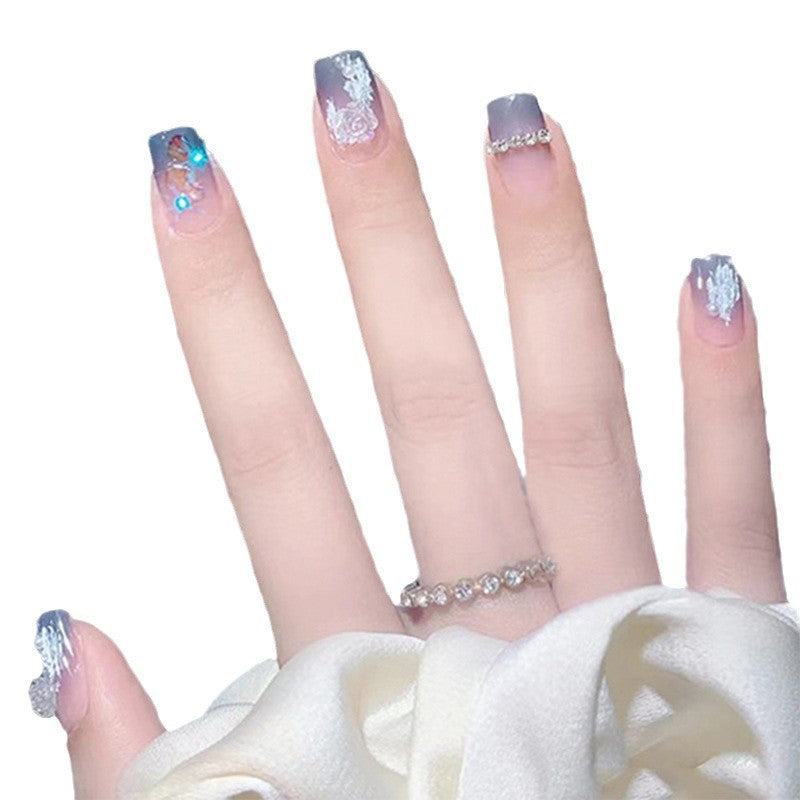 Glamorous artificial nails with heart and glitter details Stornfield