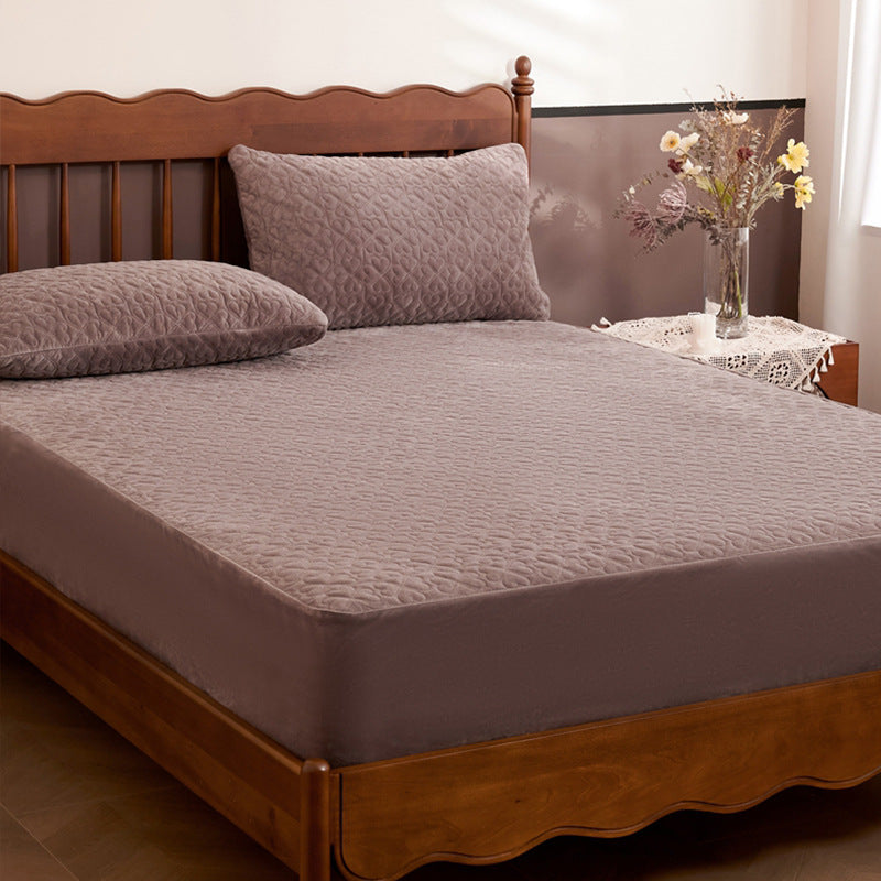 Quilted mattress protector with non-slip bottom and soft microfiber cover