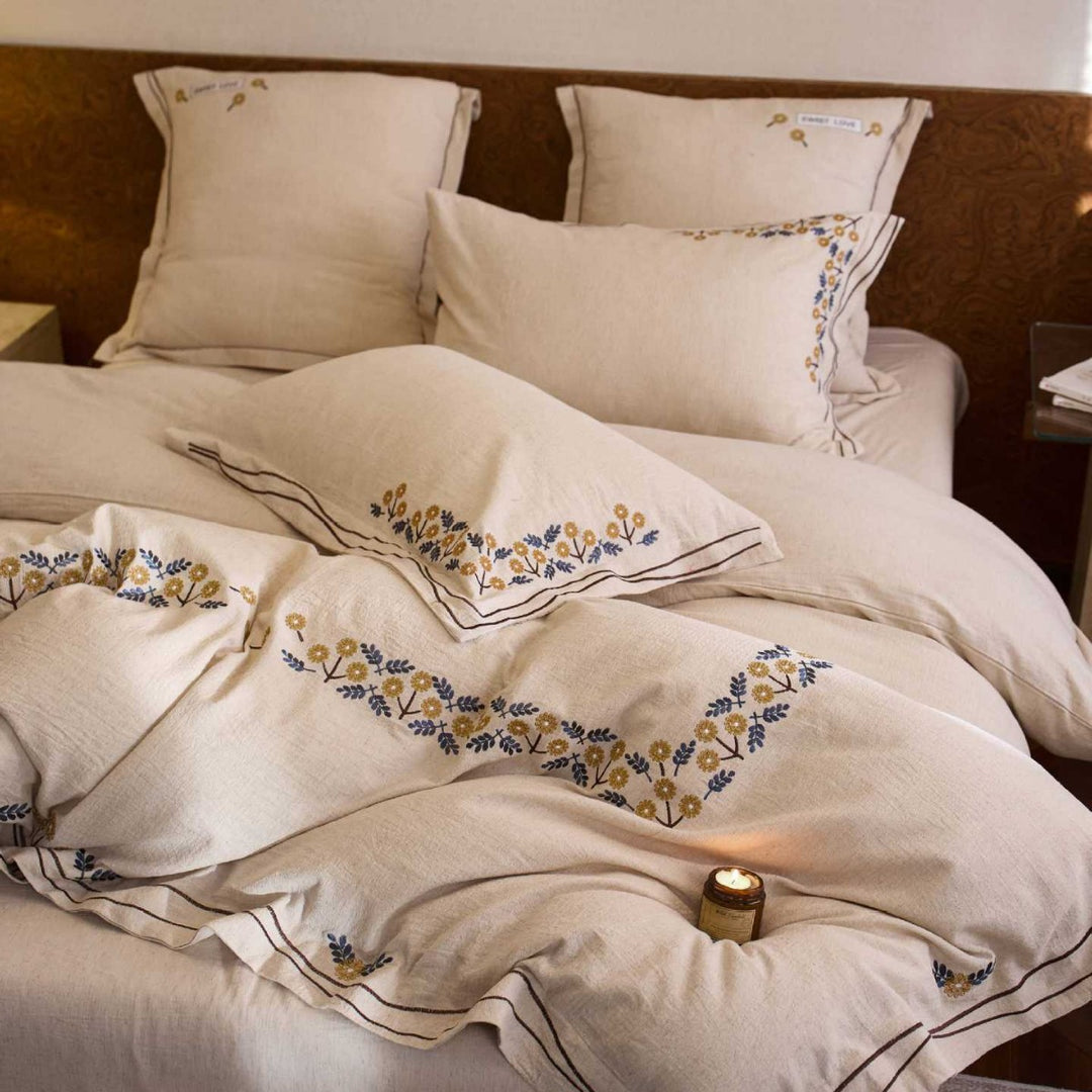 Bedding set with finely embroidered floral border design