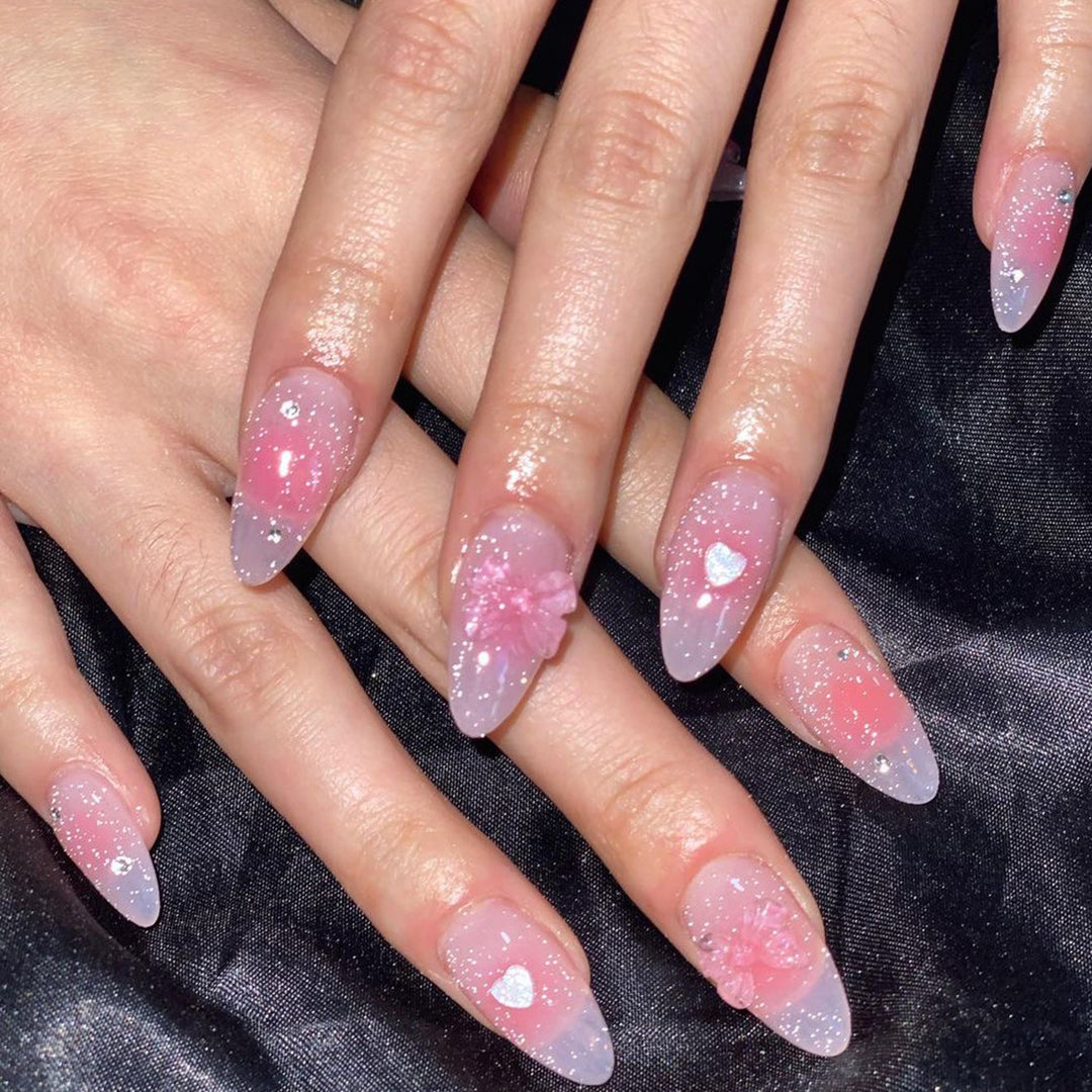 Artistic stiletto nails with floral design and glitter Stornfield