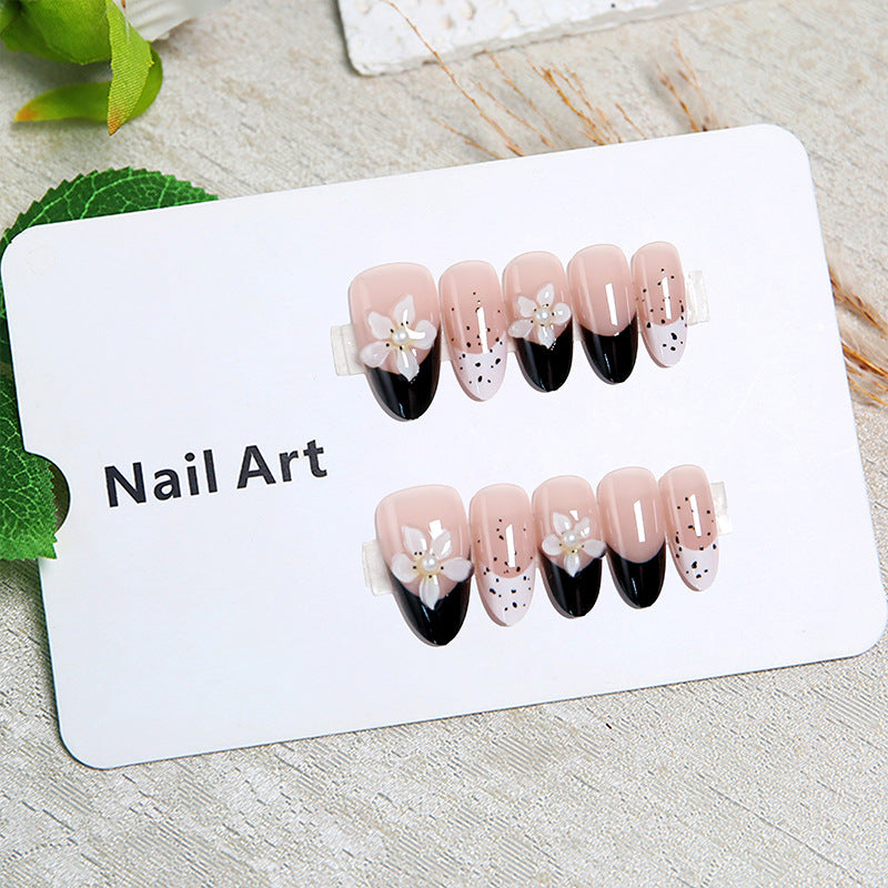 Artful nail tips with floral embellishments Stornfield