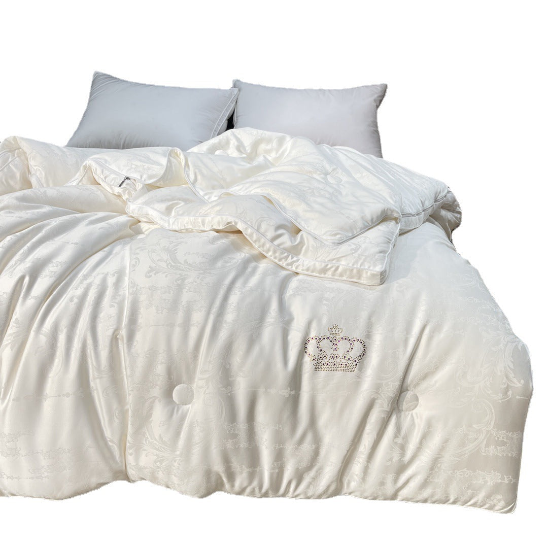 Quilted down look comforter with fine jacquard satin cover and crown embroidery