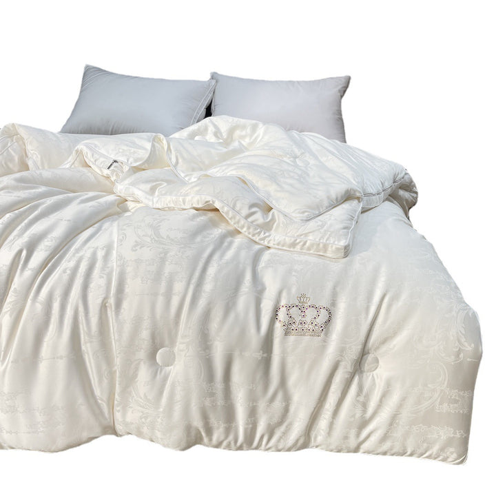 Quilted down look comforter with fine jacquard satin cover and crown embroidery