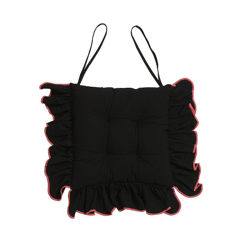 Padded chair cushion with ruffle and fastening bands