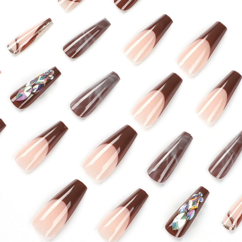 Artificial nail extensions with elegant gemstone embellishments Stornfield
