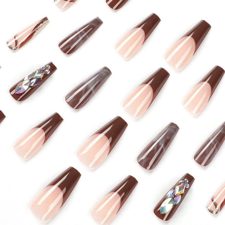 Artificial nail extensions with elegant gemstone embellishments Stornfield