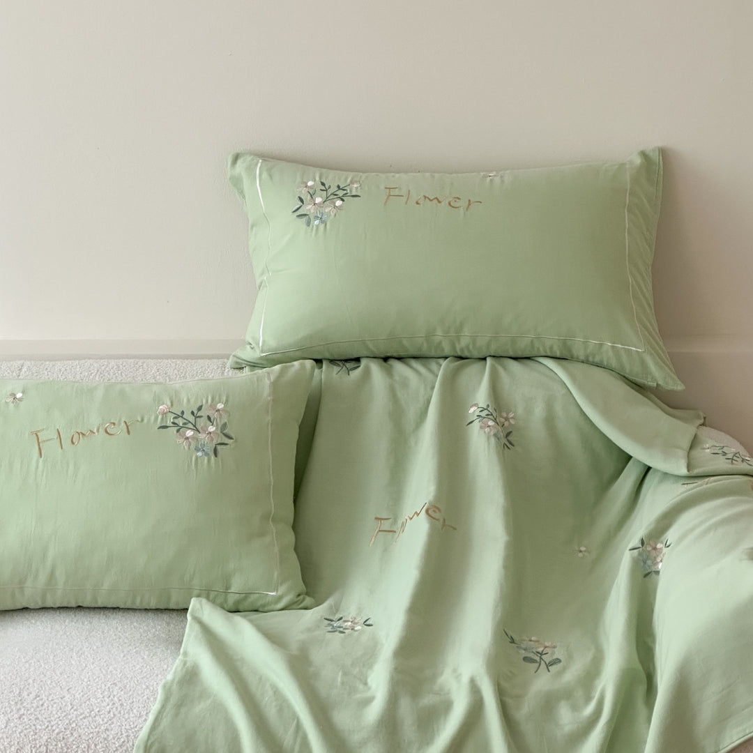 Delicate embroidered cotton bedding set with gentle botanical embroidery and bow ties Stornfield