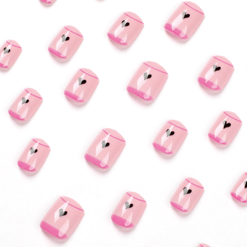Creative Nail Art with Heart Design and Glitter Accents Stornfield