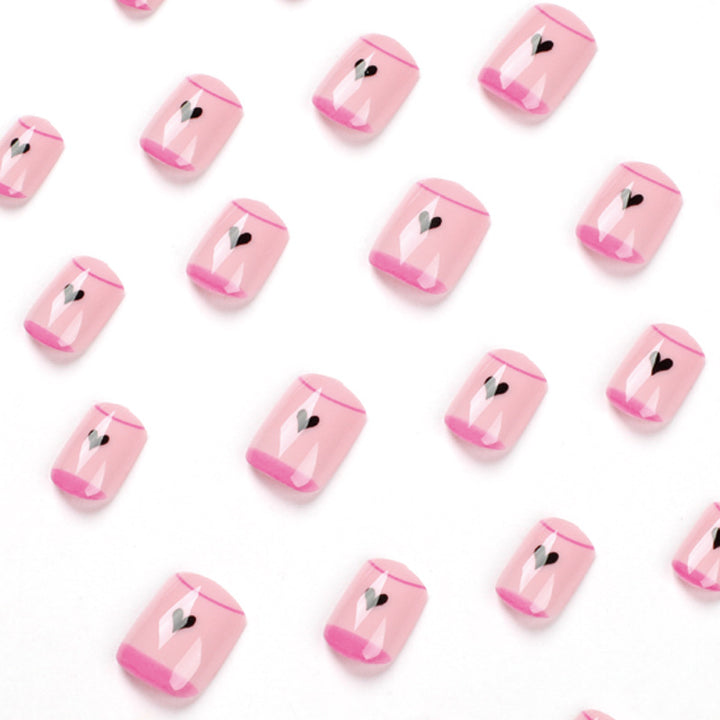 Creative Nail Art with Heart Design and Glitter Accents Stornfield