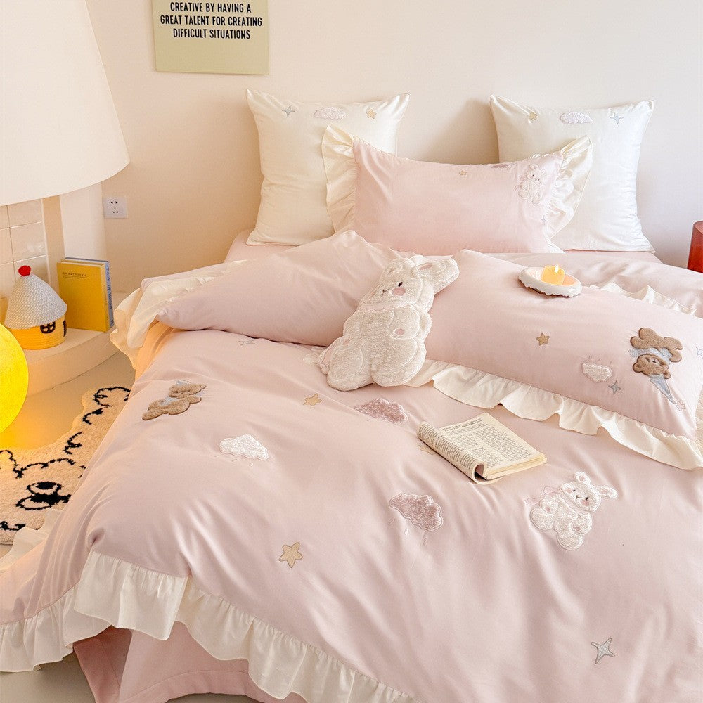Romantic ruffle bedding set with embroidered teddy bear and cloud appliqués