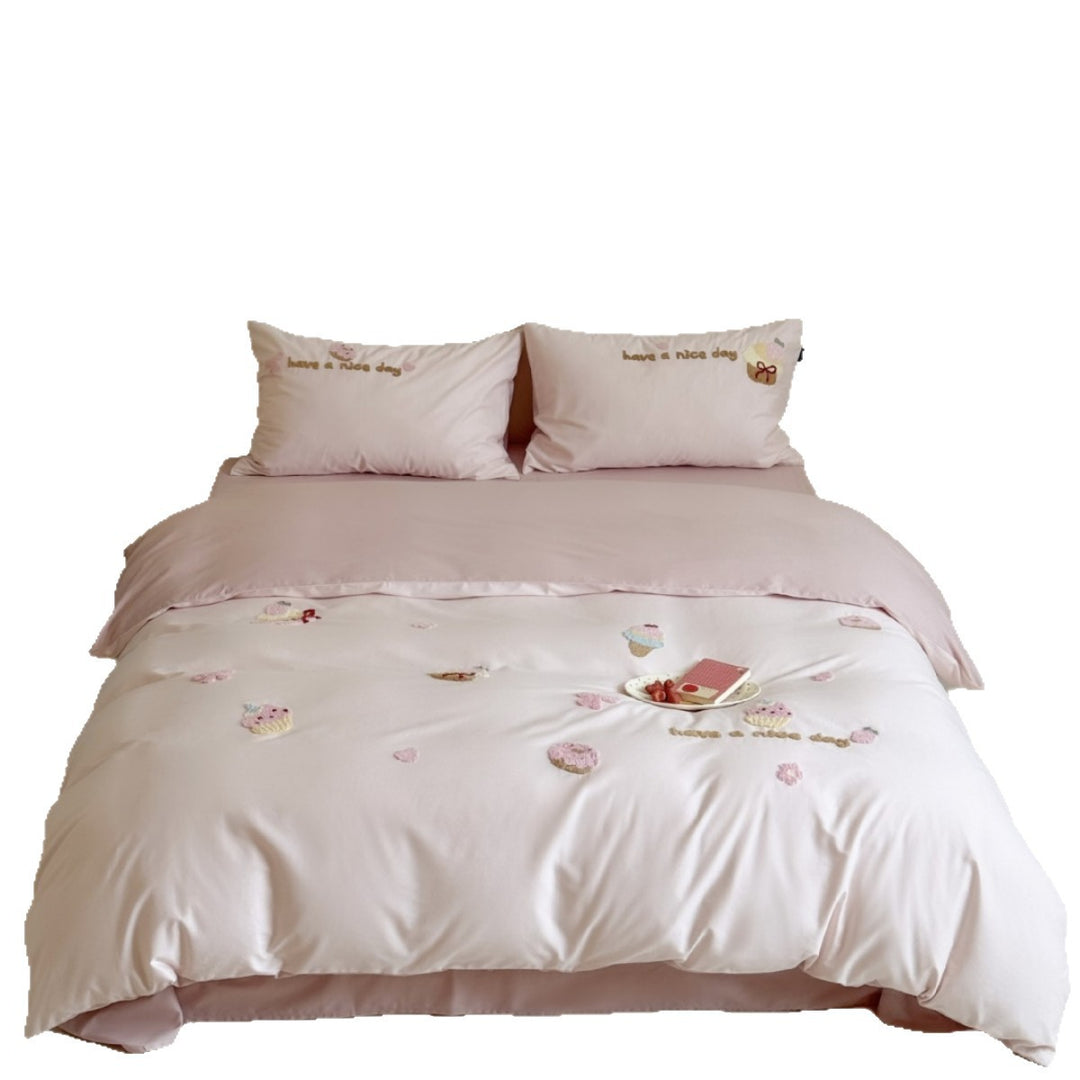 Quilted bedding set with cupcake embroideries and text application