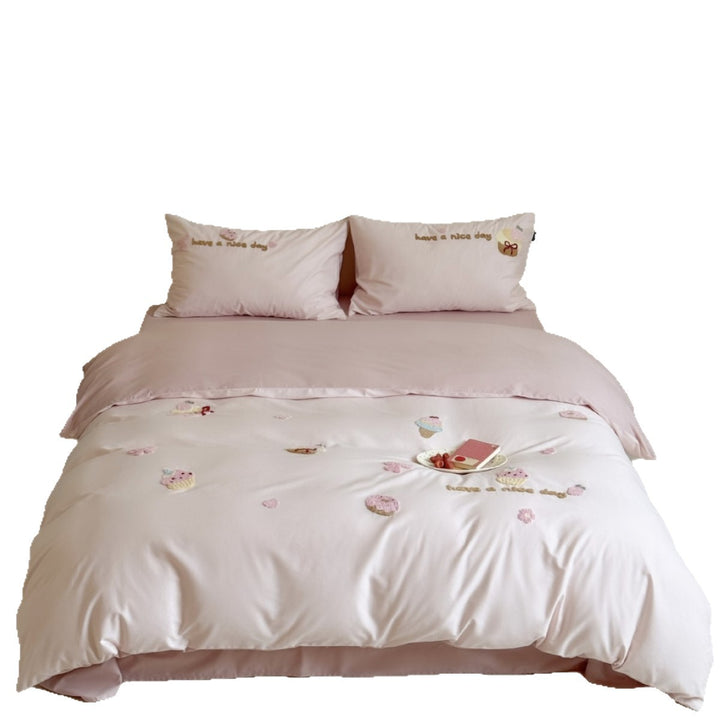 Quilted bedding set with cupcake embroideries and text application