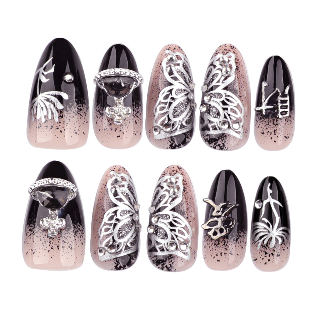 Artful stiletto nails with delicate embellishments and glamour accents Stornfield
