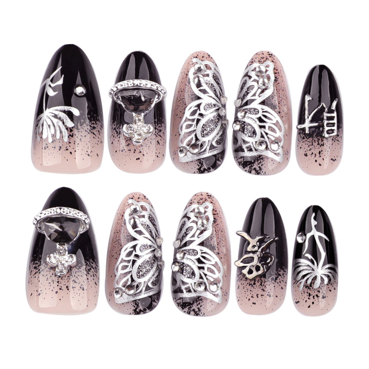 Artful stiletto nails with delicate embellishments and glamour accents Stornfield