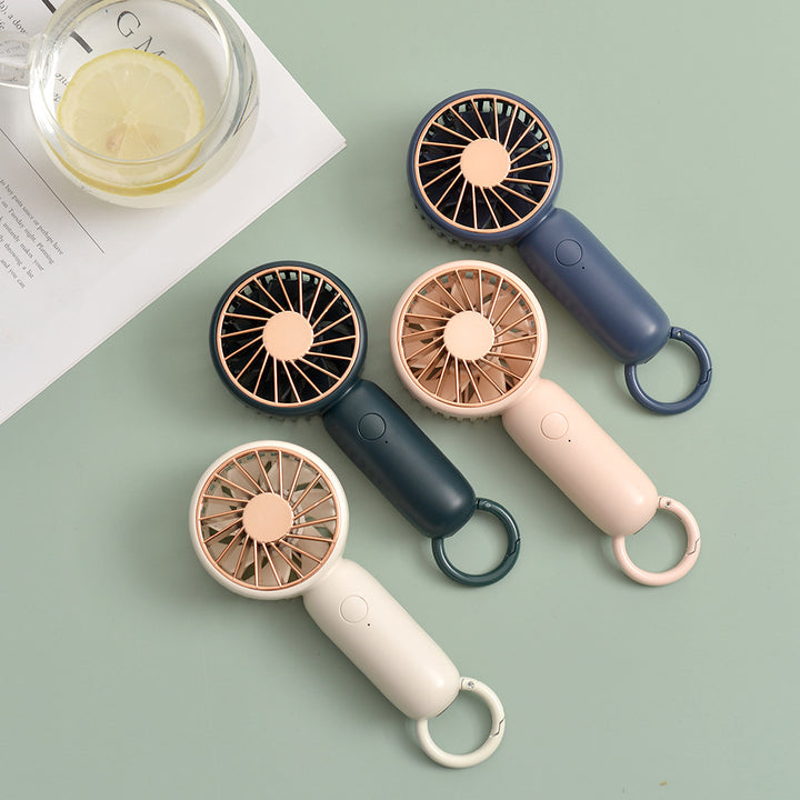 Cooling compact rechargeable handheld fan with carabiner loop and whisper-silent motor Stornfield