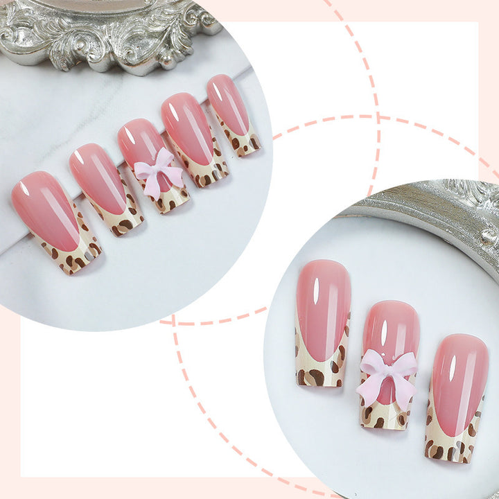 Nail set with elegant leopard accents and bow embellishments Stornfield