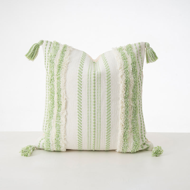 Square decorative cushion with boucle stripes, woven texture, and corner tassels