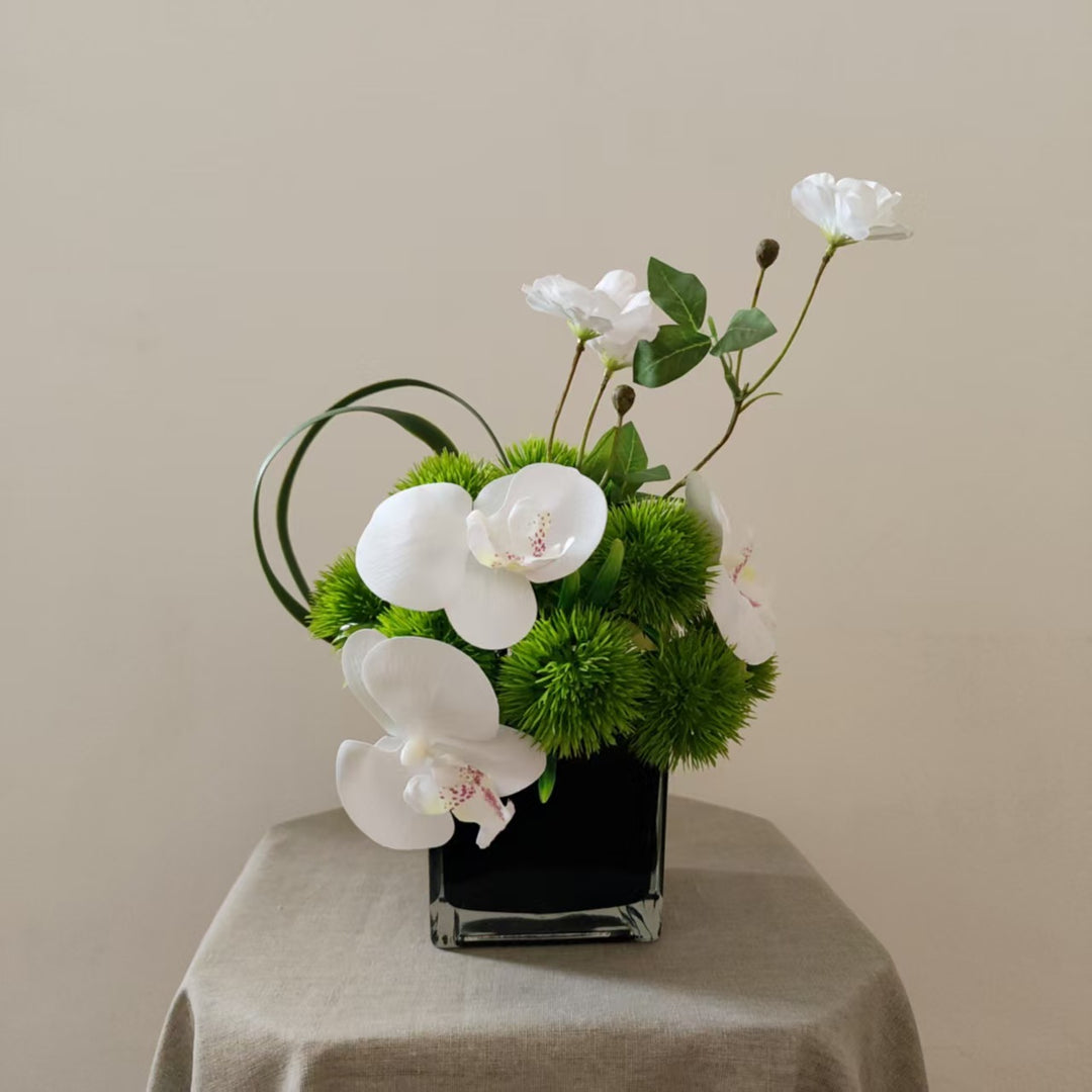 Lifelike Orchid and Greenery Floral Arrangement