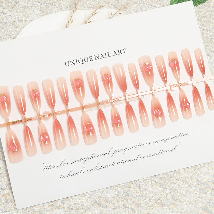 Nail set in elegant ombre design with artistic accents Stornfield