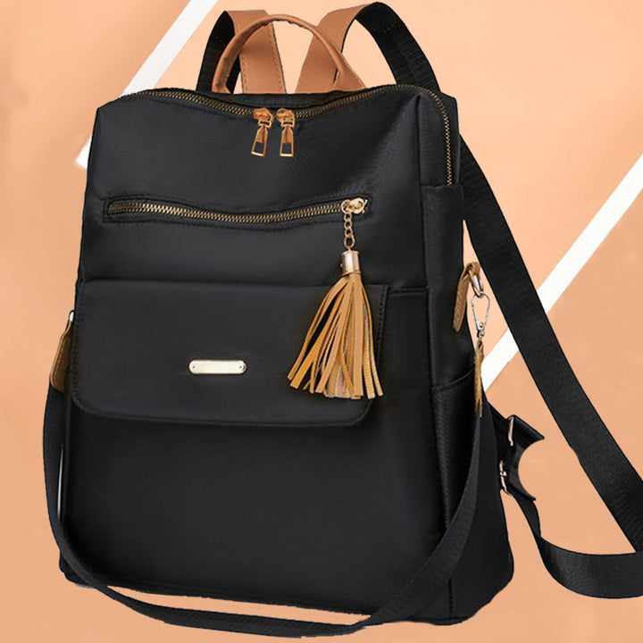 Multi-Functional Backpack with Decorative Tassel Stornfield