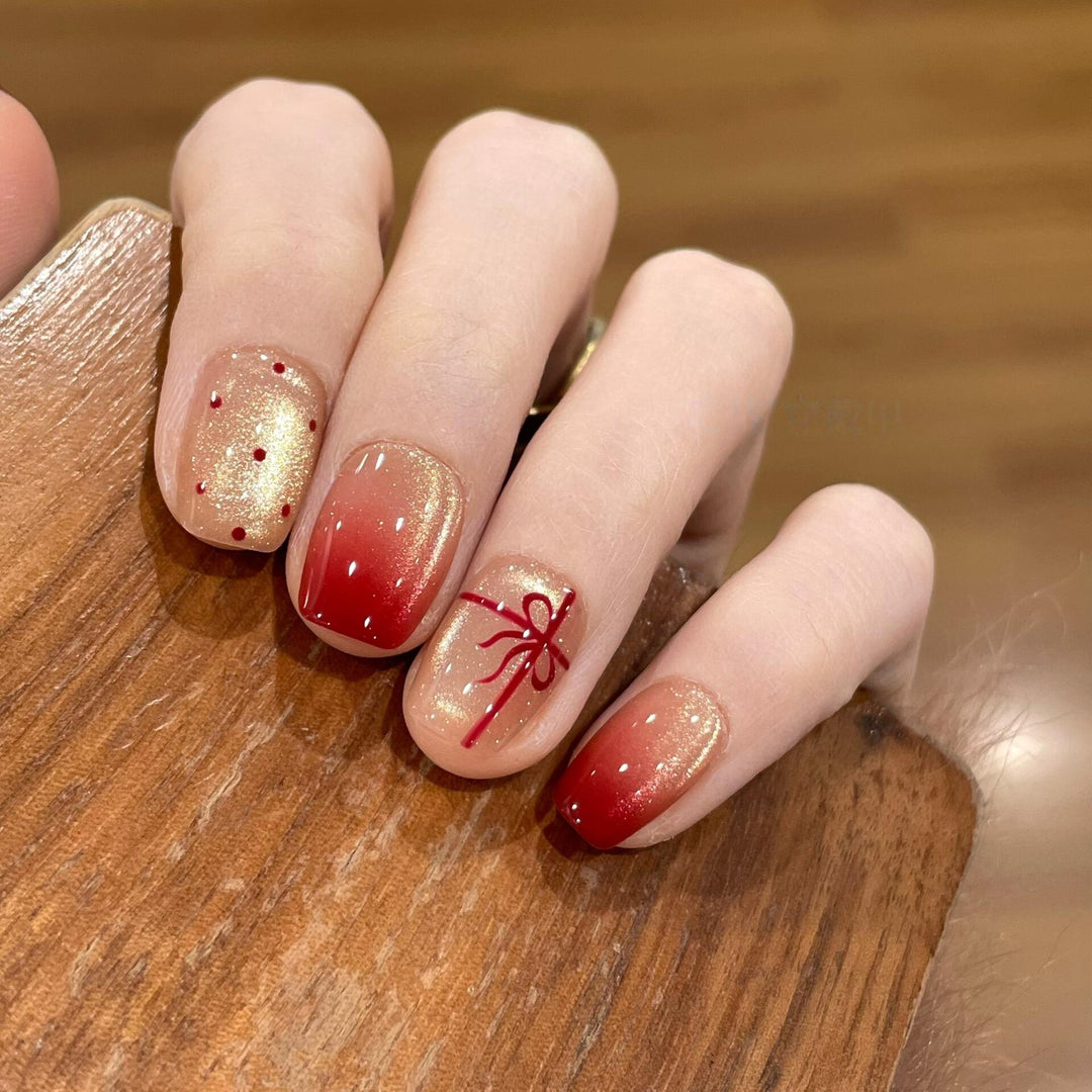 Artificial nails with festive gradient color and elegant decorations Stornfield