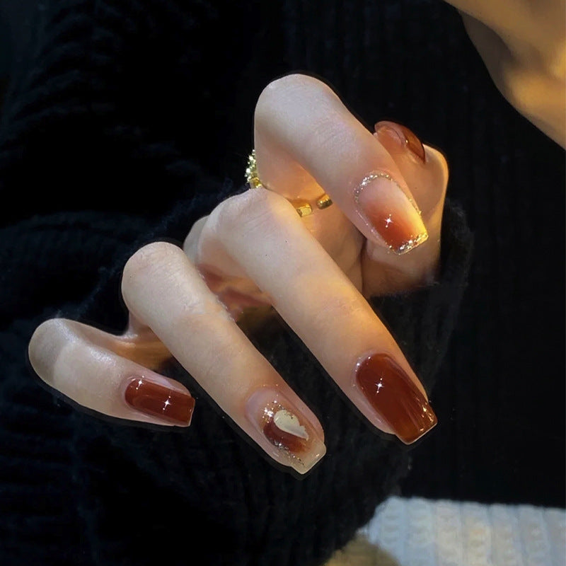 Elegant Glossy Press-On Nails with Gold Glitter Accents Stornfield