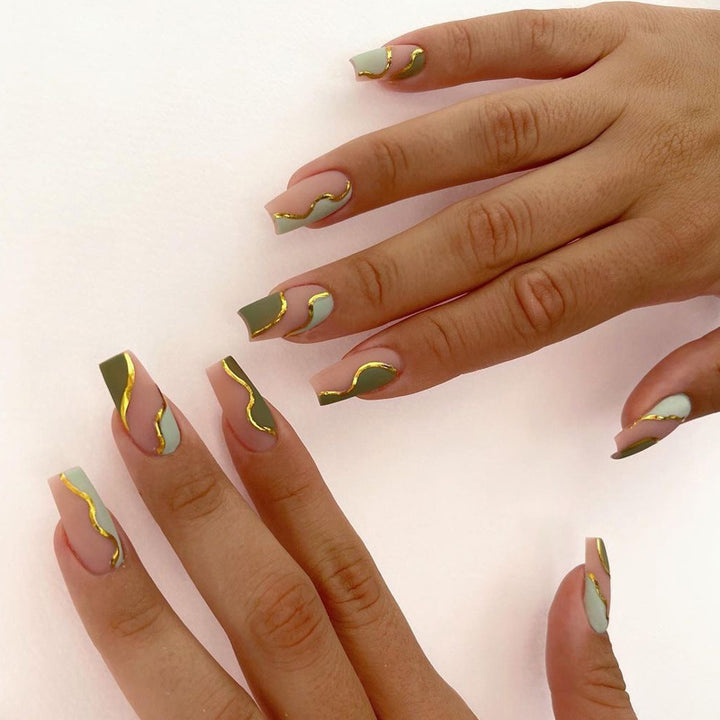 Artful Nail Extensions with Elegant Gold Decoration Design Stornfield
