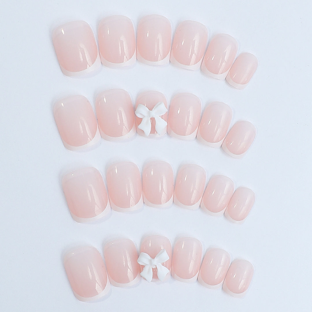 Nail set with elegant French tips and romantic floral decorations Stornfield