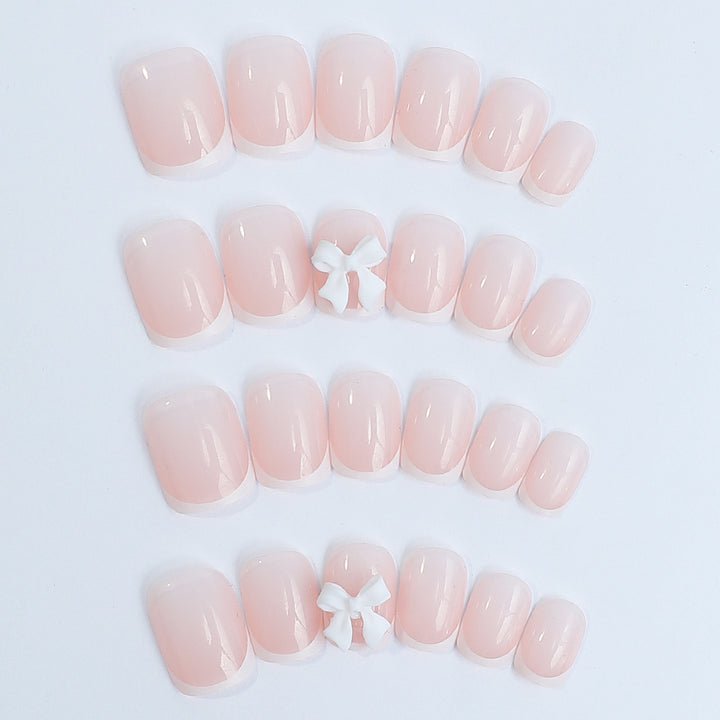 Nail set with elegant French tips and romantic floral decorations Stornfield