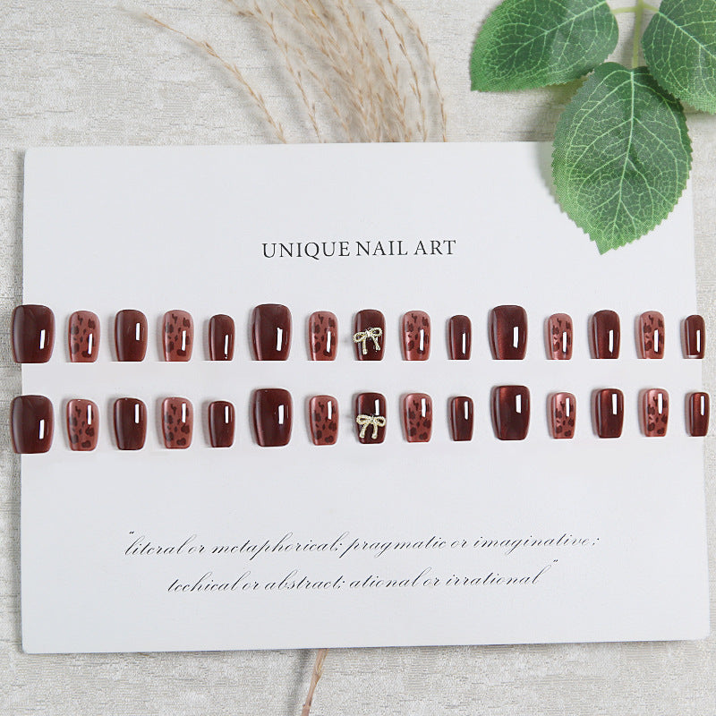 Nail set with elegant leopard pattern and luxurious accents Stornfield