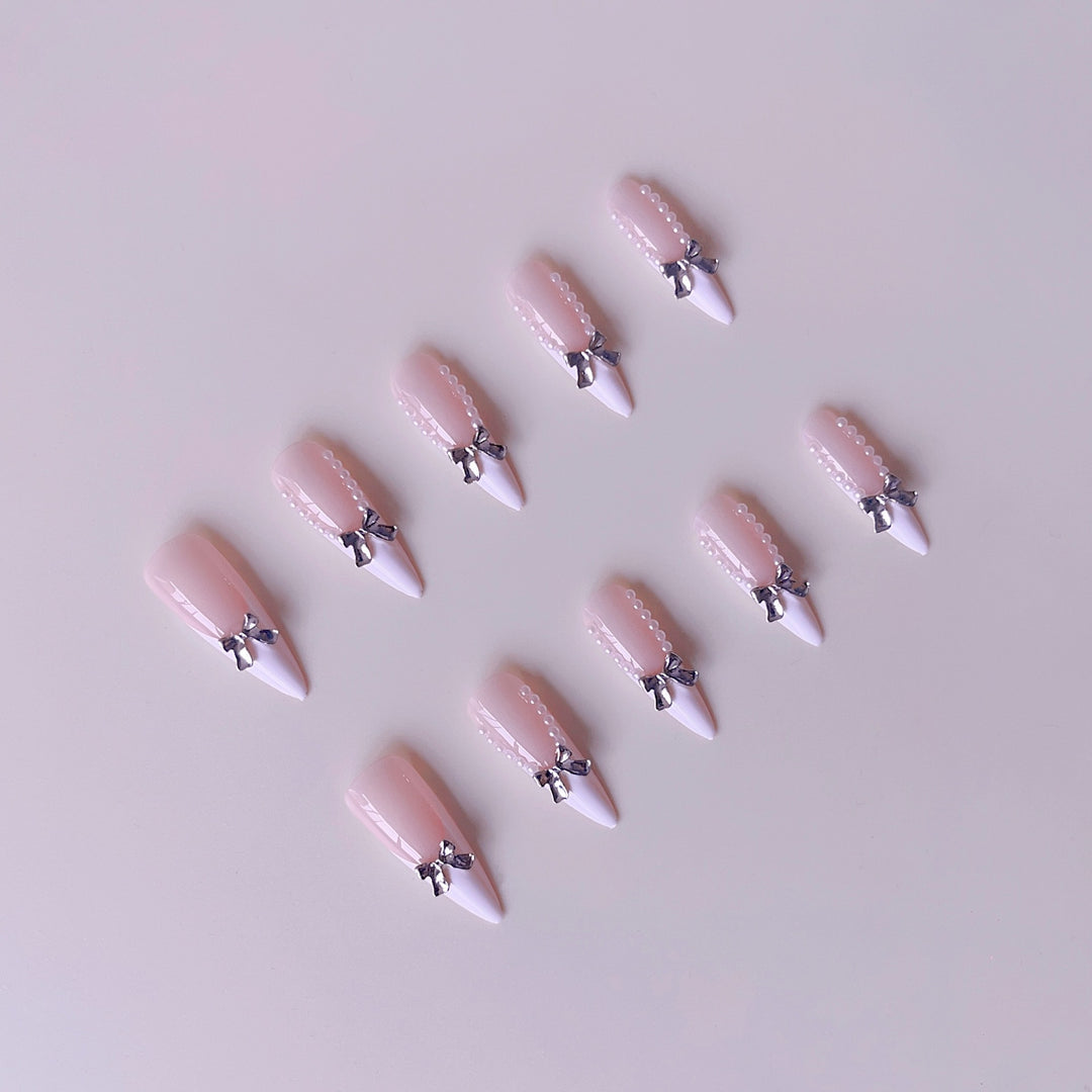 Elegant artificial nail set with 3D rhinestone details and pointed accents Stornfield