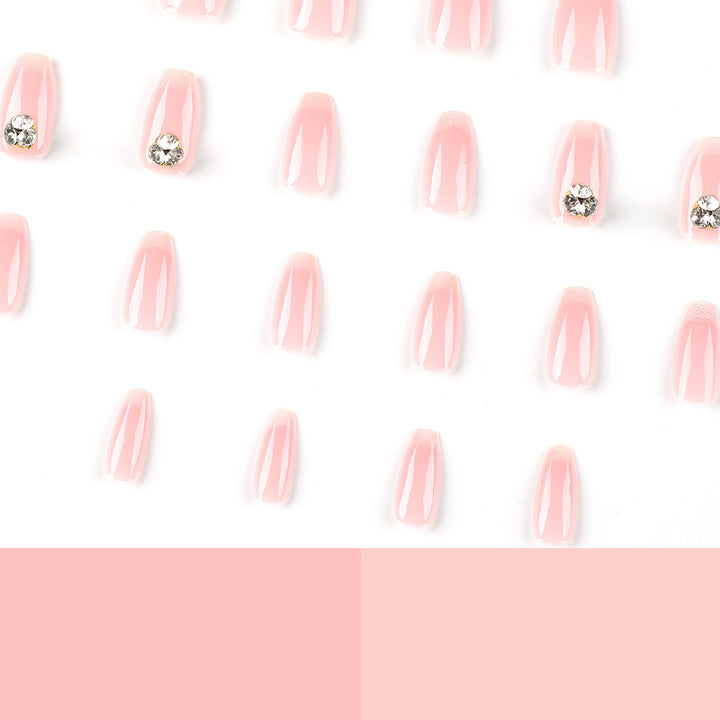 Artful nail extensions with elegant French tip and rhinestone embellishments Stornfield