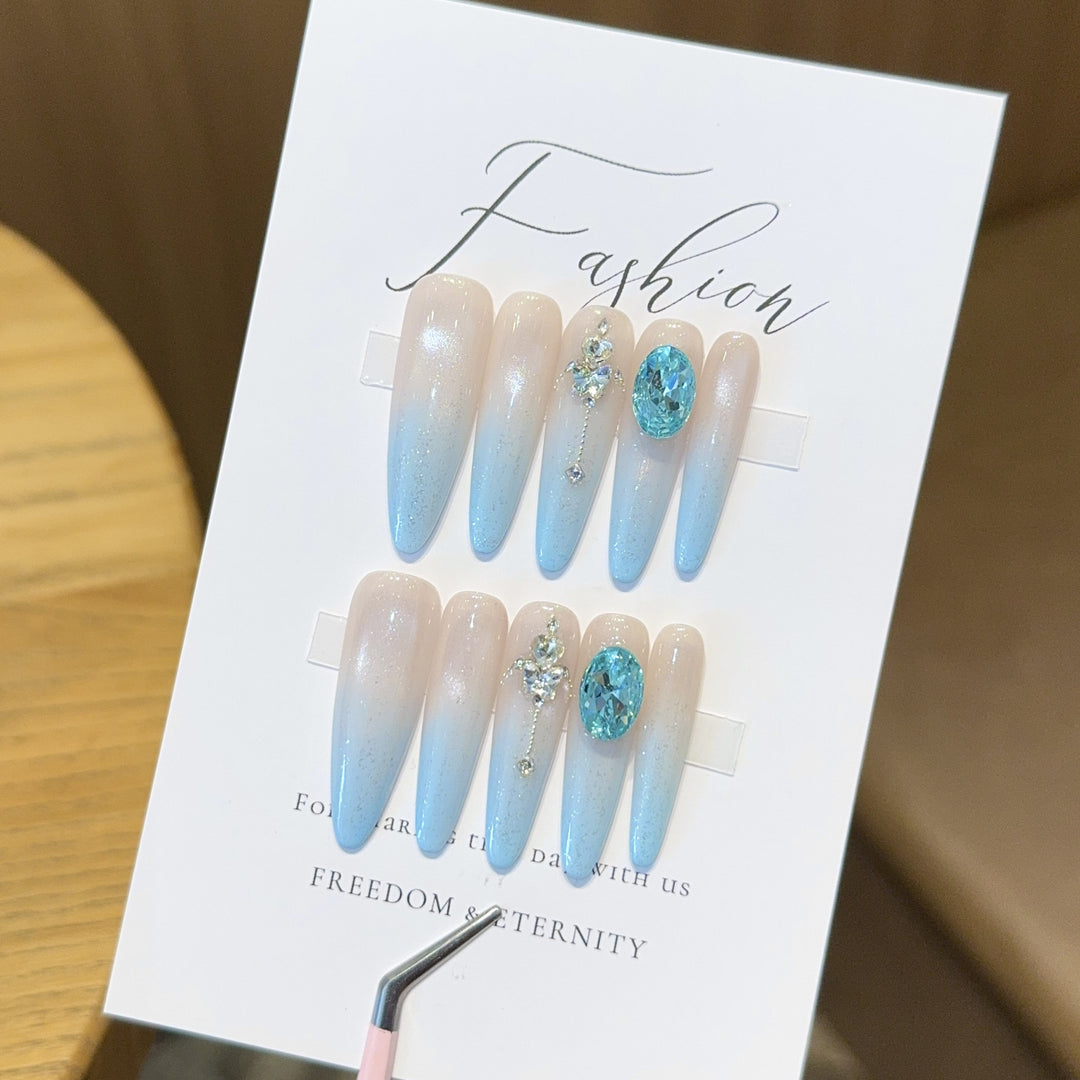 Glamorous artificial nails with sparkling rhinestone details Stornfield
