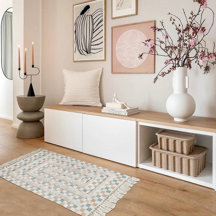 Hand-tufted bathroom mat with fringes, decorative dot-and-dash pattern and non-slip backing Stornfield