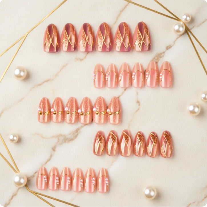 Artificial nails with elegant pearl and gold accents Stornfield